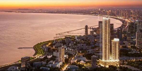 Luxury residential tower along the Worli seafront at dusk